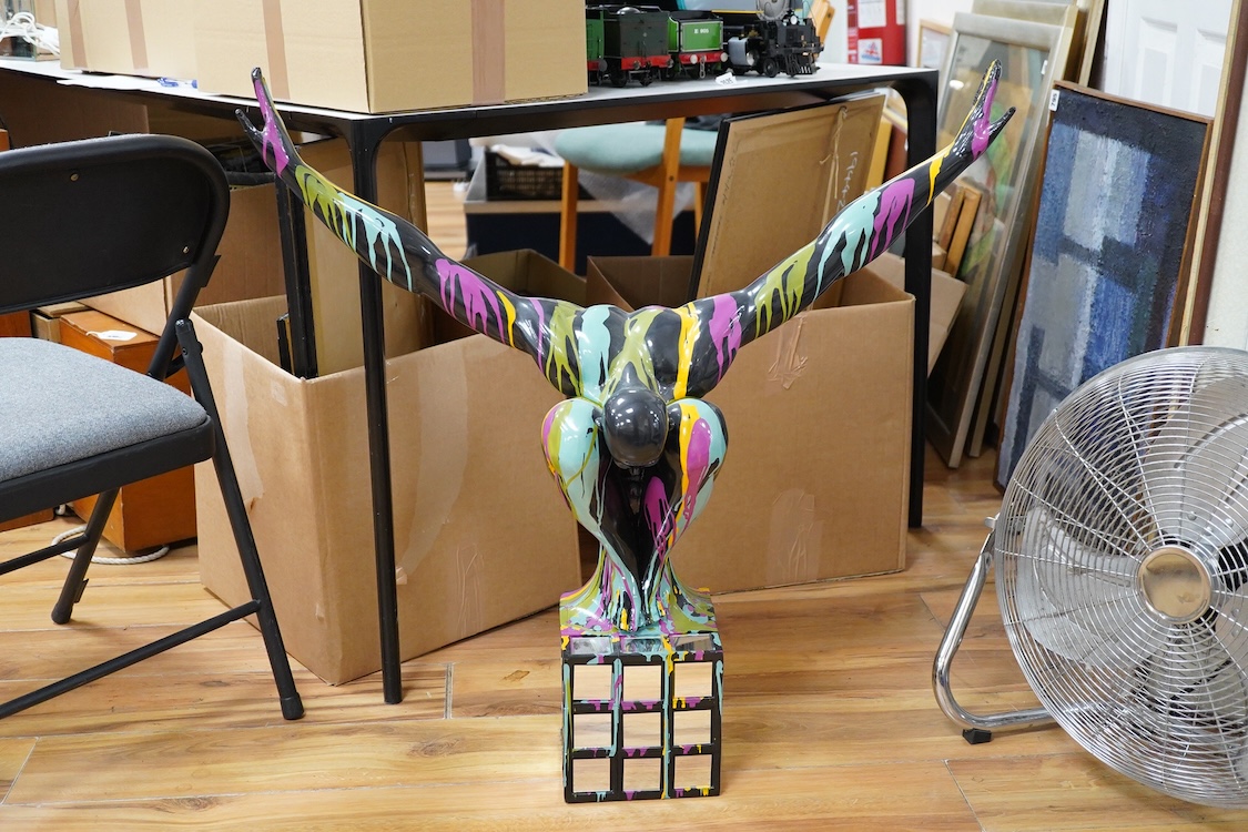 A large contemporary multicoloured composition sculpture of a diver, with mirrored base, 81cm high
